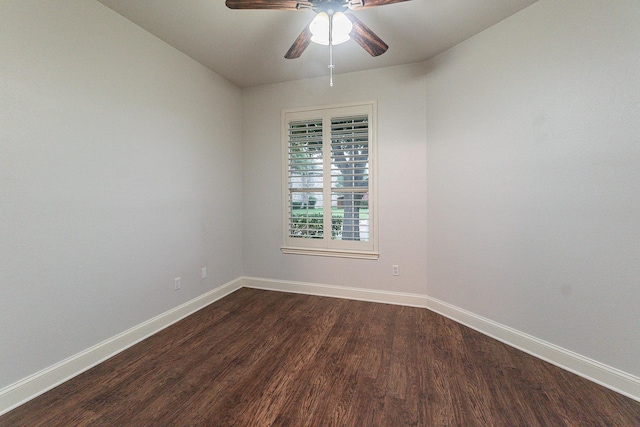 spare room featuring ceiling fan and dark hardwood / wood-style flooring