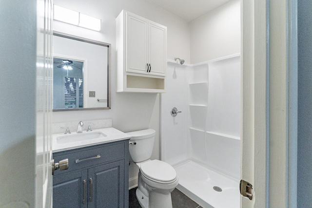 bathroom with vanity, toilet, and walk in shower