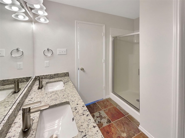 bathroom with an enclosed shower and vanity