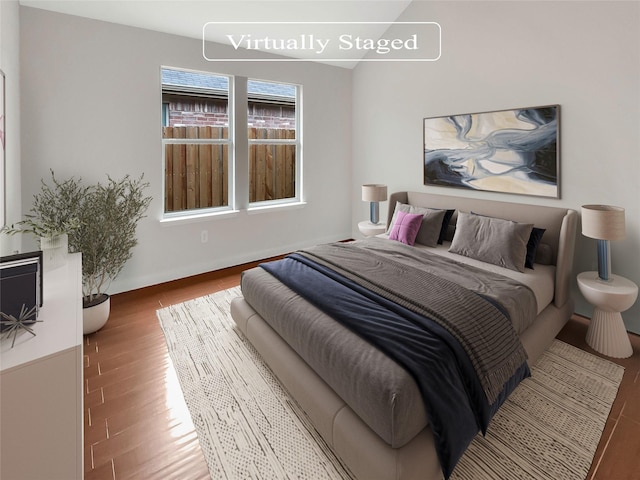 bedroom with hardwood / wood-style floors