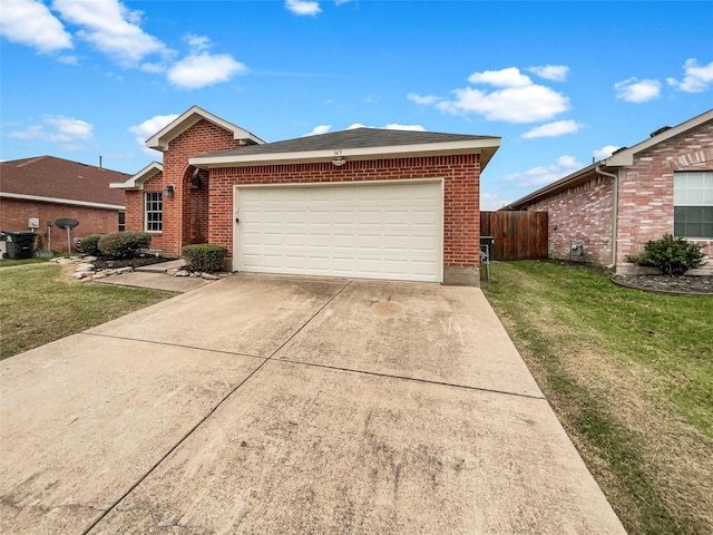 ranch-style home featuring a garage and a front yard