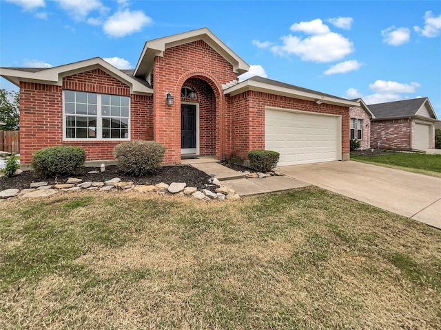 view of front of property with a garage and a front lawn