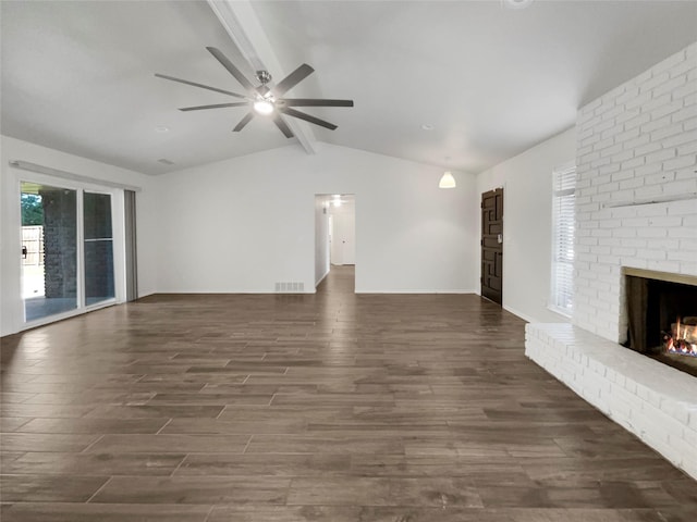 unfurnished living room featuring a fireplace, vaulted ceiling with beams, dark hardwood / wood-style flooring, and ceiling fan