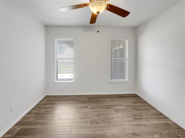 unfurnished room featuring ceiling fan and hardwood / wood-style floors