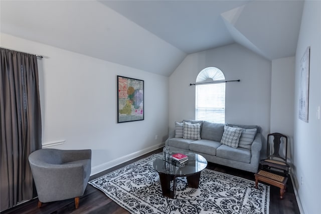 living room with hardwood / wood-style floors and lofted ceiling