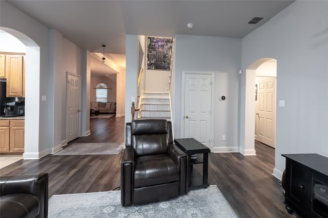 living room with dark wood-type flooring