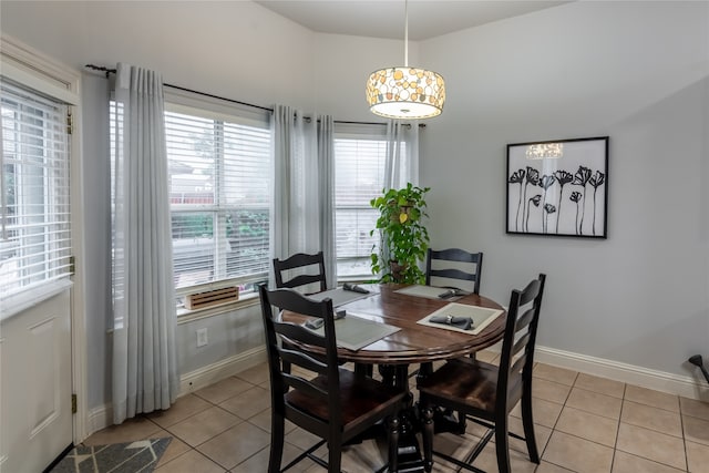 dining area with light tile patterned floors