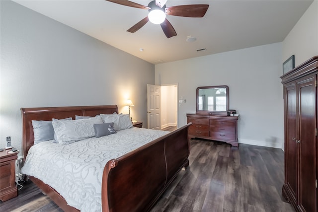 bedroom with ceiling fan and dark wood-type flooring