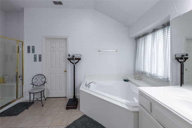 bathroom with tile patterned flooring, vanity, lofted ceiling, and shower with separate bathtub