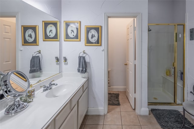 bathroom featuring a shower with door, tile patterned flooring, and vanity