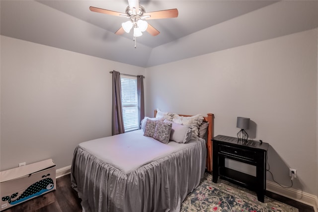 bedroom with ceiling fan, vaulted ceiling, and hardwood / wood-style floors