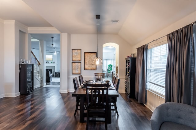 dining space featuring dark wood-type flooring and lofted ceiling