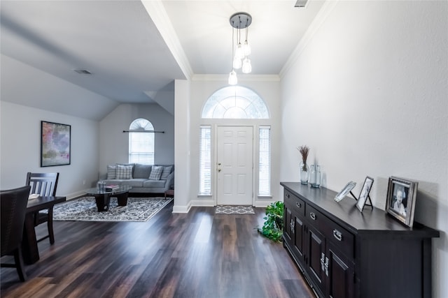 entrance foyer featuring ornamental molding and dark hardwood / wood-style flooring