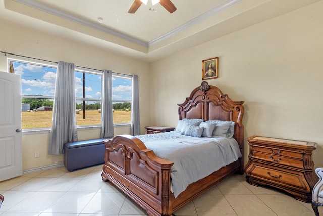 tiled bedroom featuring ceiling fan and a raised ceiling