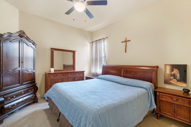 tiled bedroom with ceiling fan