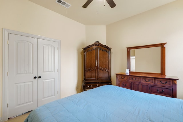 bedroom with ceiling fan and a closet