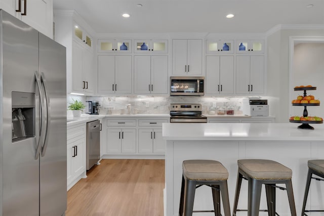 kitchen with white cabinetry and stainless steel appliances