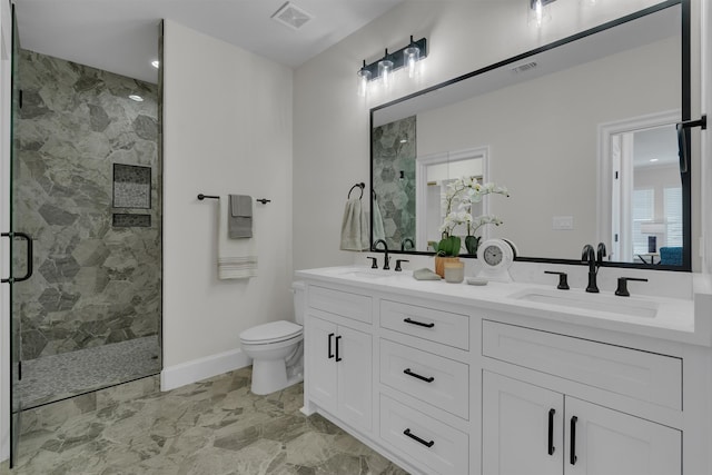 bathroom with walk in shower, dual bowl vanity, tile flooring, and toilet