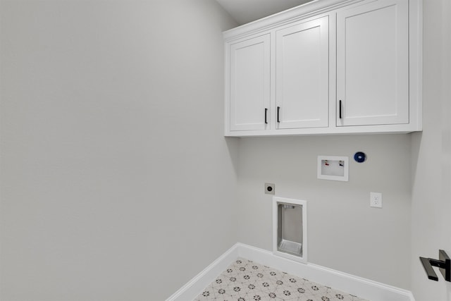 clothes washing area with cabinets, hookup for an electric dryer, hookup for a washing machine, hookup for a gas dryer, and light tile floors