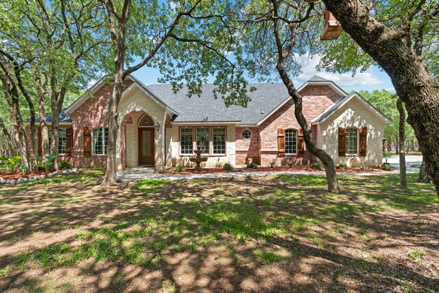 view of front of home with a front lawn