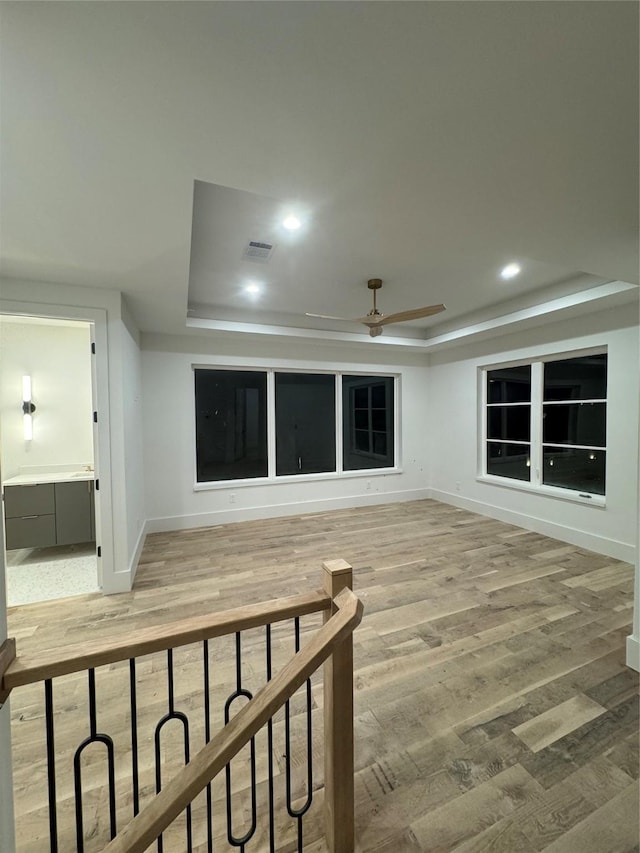 additional living space featuring ceiling fan and hardwood / wood-style floors