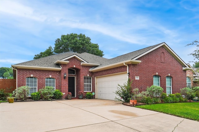 ranch-style house featuring a garage