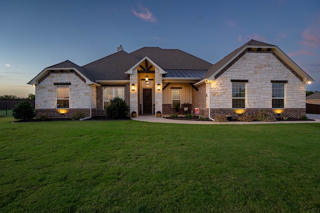 craftsman-style house featuring a yard