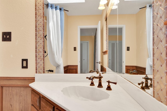 bathroom with vanity and a skylight