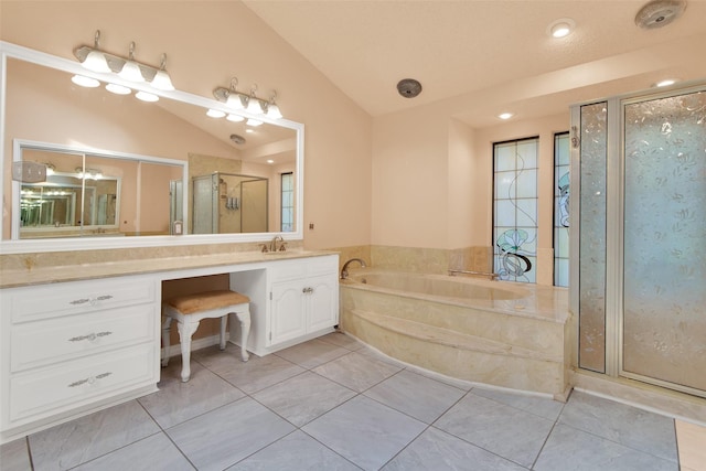 bathroom featuring tile patterned floors, vanity, independent shower and bath, and vaulted ceiling