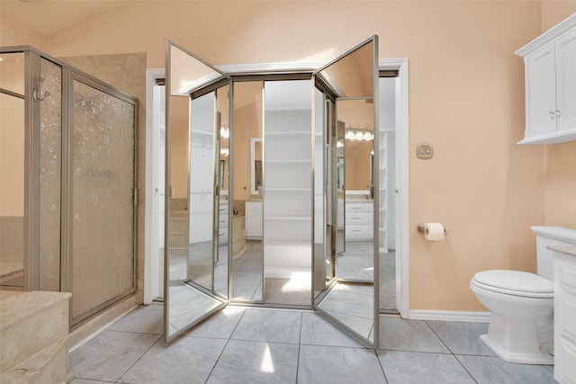 bathroom featuring tile patterned floors, toilet, an enclosed shower, and vaulted ceiling