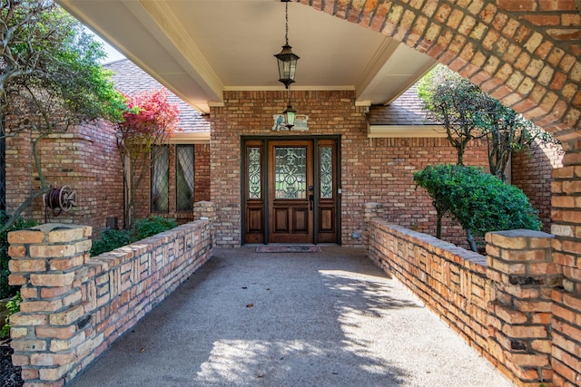 view of exterior entry featuring a porch