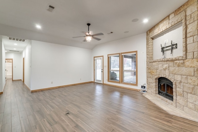 unfurnished living room featuring a fireplace, hardwood / wood-style flooring, and ceiling fan