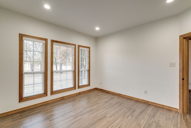 unfurnished room featuring hardwood / wood-style floors