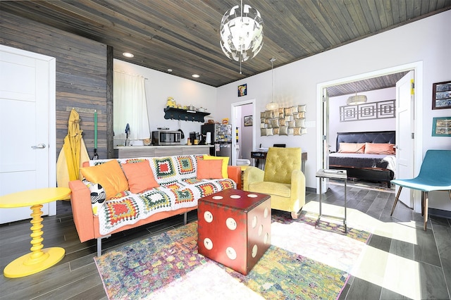 living room featuring wood ceiling, a notable chandelier, and wood walls