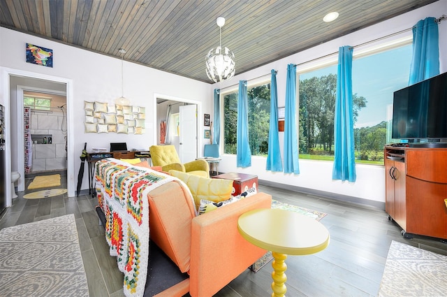 living room featuring a healthy amount of sunlight, a chandelier, wooden ceiling, and dark hardwood / wood-style flooring