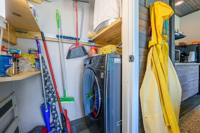 clothes washing area featuring washer / dryer