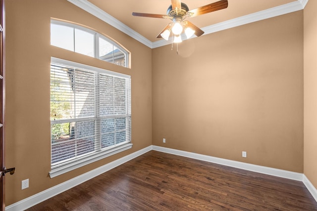 unfurnished room featuring plenty of natural light, dark wood-type flooring, baseboards, and ornamental molding