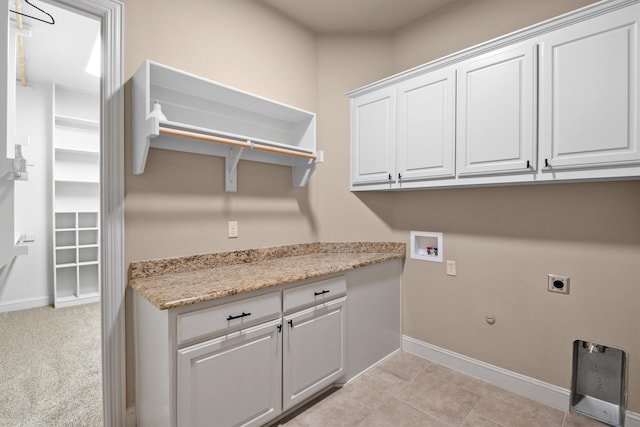 clothes washing area featuring baseboards, hookup for a washing machine, hookup for a gas dryer, cabinet space, and hookup for an electric dryer