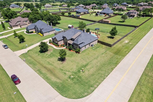 birds eye view of property with a residential view