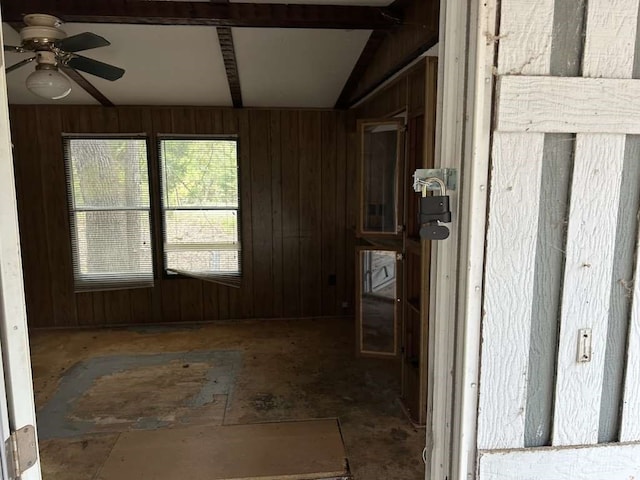 interior space featuring lofted ceiling and ceiling fan