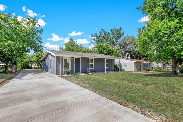 single story home featuring a front lawn and covered porch