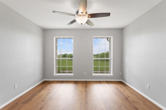 419 State Highway 205th Ext, Rockwall, TX 75032 - empty room featuring wood finished floors, baseboards, ceiling fan, and a textured wall