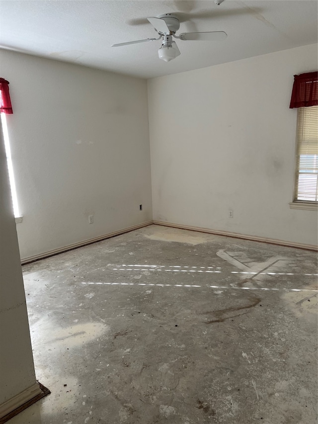 spare room featuring ceiling fan and a textured ceiling