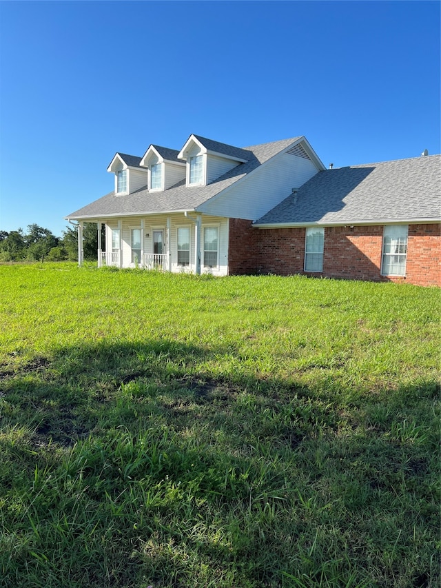 view of front of home with a front yard