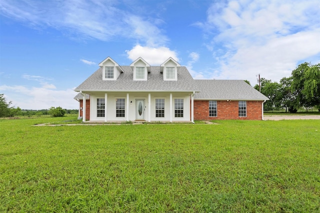 419 State Highway 205th Ext, Rockwall, TX 75032 - cape cod home featuring a front lawn, roof with shingles, and brick siding