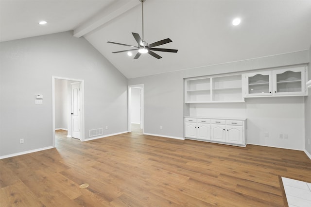 419 State Highway 205th Ext, Rockwall, TX 75032 - unfurnished living room featuring beam ceiling, a ceiling fan, light wood-style flooring, baseboards, and high vaulted ceiling