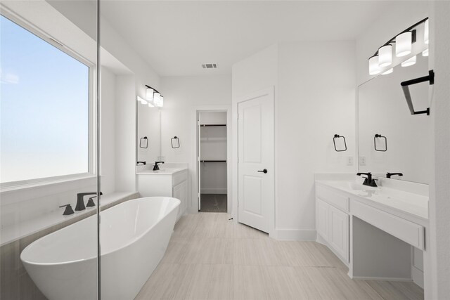 bathroom featuring vanity and a bathtub