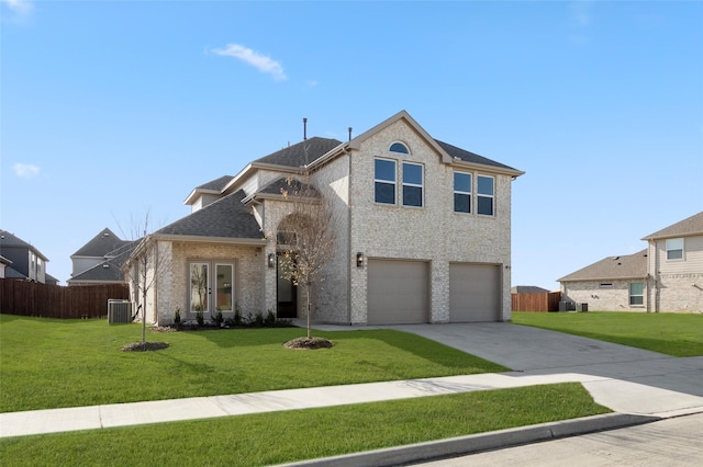 view of front property with a front lawn, a garage, and central AC