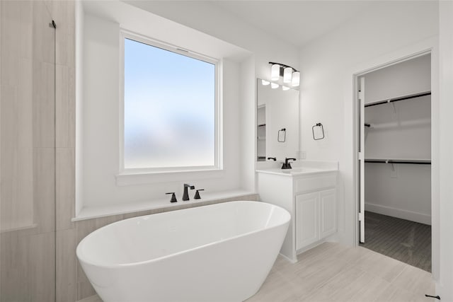 bathroom with a bathtub and vanity