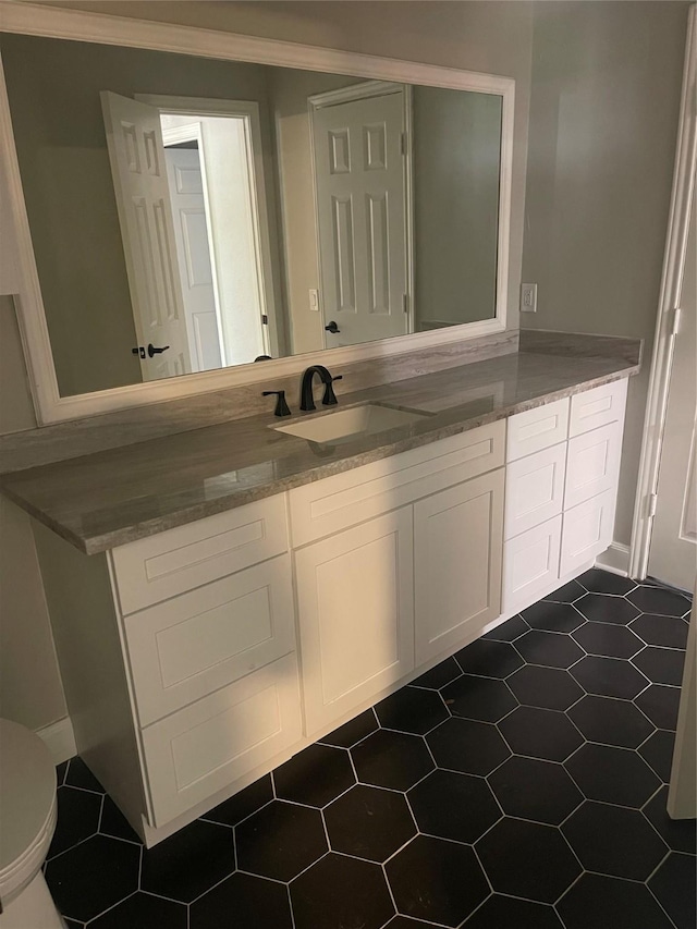 bathroom with vanity and toilet